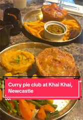 A couple visits Khai Khai in Newcastle to review their new 'Curry Pie Club' Sunday menu. The video features the creators discussing the menu, showing the food, and includes a brief behind-the-scenes look at the kitchen preparation.
