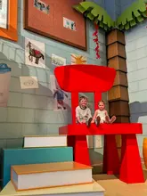 A walkthrough of the Mundo Pixar immersive exhibition in London, featuring various life-size sets from popular Pixar films. The video follows two children as they explore and interact with the different themed rooms, highlighting the photo opportunities available.