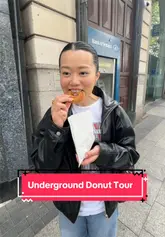 A creator and her partner participate in a guided walking donut tour in Dublin, visiting multiple shops including The Rolling Donut, Sweet Churro, and Offbeat. The video features the creator talking to the camera, showing the donuts, and highlighting the tour guide's knowledge of Irish history.
