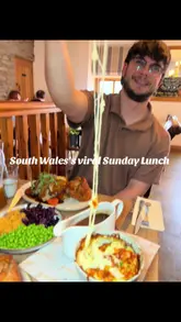 A couple visits Bistro 8 for a Sunday lunch, showcasing the roast dinner, starters like chicken wings and onion rings, and desserts. The video features close-ups of the food, including a cheese pull on the cauliflower cheese, and shots of the venue's interior and exterior.