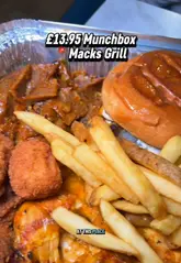 A creator reviews a 'Munchbox' meal from Mack's Grill in Welling, showcasing the various items included such as a smash burger, chicken wings, fries, and desserts. The video uses a fast-paced, vlog-style format to highlight the value and taste of the food.