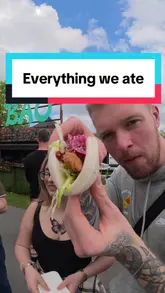 A couple visits a food festival in Newcastle, sampling a variety of street food items including prosecco, Portuguese tarts, Jamaican patties, banh mi, mini pancakes, chicken tacos, and bao buns.