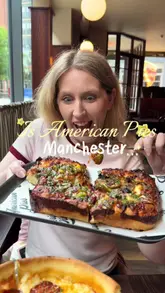 A couple visits American Pies in Manchester to compare Chicago deep dish and Detroit-style pizzas. The video features the exterior, interior, menu, and a taste test of both pizza styles, highlighting the cheese pull and crispy crusts.