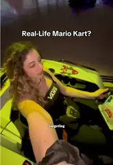 A high-energy, first-person POV video showcasing an indoor go-karting experience that uses floor projections to create an interactive, Mario Kart-style game.