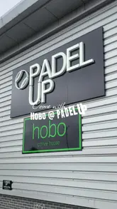 The video features a visit to Padel Up and Hobo Coffee House, showcasing the Padel courts and the cafe's food and drink menu, including cakes, coffee, and breakfast items.