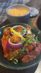 A vlog-style review of The Malletsheugh restaurant in Newton Mearns, showcasing the interior, the extensive Indian/Scottish fusion menu, and various dishes including starters, mains, and desserts.