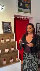 A promotional video for a luxury scent experience in Dublin, showing the process of selecting and creating a custom fragrance, followed by the packaging of the final product and a brief shot of a cocktail.