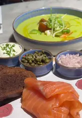 A short, polished montage showcasing a selection of dishes from the set menu at Duck & Waffle in Edinburgh, including a crab cake, risotto, smoked salmon, cheesecake, and a waffle dessert.