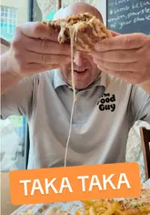 A food review vlog featuring a couple visiting Taka Taka in Bristol to try various Greek street food items, including the Skepasti, moussaka roll, and cheese balls.