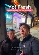 A vlog-style review of an all-you-can-eat hot pot and BBQ restaurant in Leicester, featuring two creators who guide viewers through the ordering process, the buffet selection, and the cooking experience.