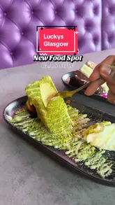 A promotional reel for Lucky's Diner in Glasgow, showcasing their new dessert menu and main courses. The video features a montage of plated dishes, including a T-bone steak platter, peri burger, and various desserts, set against the backdrop of the restaurant's purple-themed interior.