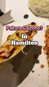 A short video review of a 'Pakora Calzone' from a takeaway shop called House of Shah in Hamilton. The creator shows the food, the menu, and the shop front while providing a voiceover review.