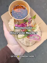 A short, engaging video showcasing a Sichuan street food stall called Mama Lala at the Riverside Market in Cardiff. The video features close-ups of freshly steamed dumplings with chili oil, the cooking process, the menu, and the market environment.