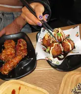 A group of friends visits Maki & Ramen for a bottomless brunch, showcasing a wide variety of Japanese dishes including sushi rolls, gyoza, tempura, and cocktails. The video highlights the value of the deal and the quality of the food, with a fast-paced, enthusiastic voiceover.