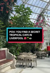 A creator visits a cafe located inside the Palm House in Sefton Park, Liverpool, showcasing the tropical, glasshouse setting and the available coffee and pastry options.