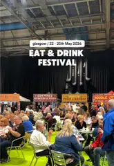 A montage video showcasing the Eat & Drink Festival at the Ideal Home Show in Glasgow, featuring various food and drink stalls, home decor displays, a cooking stage, and entertainment like giant chess.