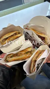 The video follows a group of friends and family participating in a 'Food Escapes' scavenger hunt in Manchester. It features the group solving clues, walking through the city, and visiting various food venues to try different dishes, including bao buns, street food, and waffles.