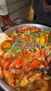 A couple visits Rock & Scallop in Swansea to try their seafood boil, sharing their experience of the food and the casual dining atmosphere.