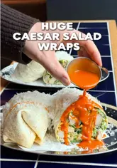 A creator reviews large Caesar salad wraps from Dough Religion in Manchester, highlighting the classic and buffalo flavors.