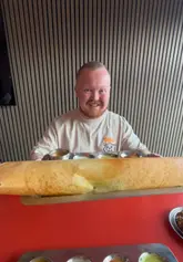A couple visits a South Indian vegetarian restaurant called Pappu Dosa in Patchway, Bristol. They review several dishes including masala dosa, vada pav, samosas, and cauliflower manchurian, highlighting the fresh flavours and excellent value for money.