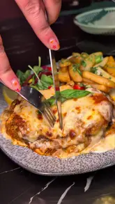 A fast-paced, engaging review of Xotica Restaurant, featuring a variety of dishes including a unique keema lasagna, an Asian-style sizzler platter, steak, and grilled salmon. The video highlights the restaurant's vibrant atmosphere and family-friendly appeal.