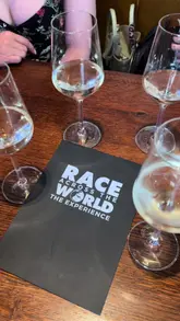 A group of friends participates in an interactive 'Race Across The World' experience in Edinburgh, solving puzzles and visiting landmarks before heading to a bar for drinks and small plates.