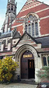 A clear, vertical exterior shot of a restaurant named Emre, which is located in a converted church building. The image uses the architectural height of the building to fill the frame effectively.