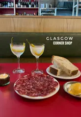 A montage of various small plates and the interior of Corner Shop in Glasgow, highlighting the restaurant's atmosphere and food offerings.