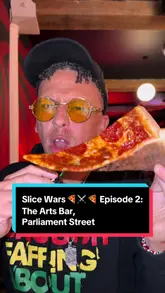 A creator visits Arts Bar in Liverpool as part of a 'Slice Wars' series to review their pizza by the slice. The video features the venue's interior, the pizza preparation process, and a taste test of both pepperoni and margherita slices, accompanied by homemade garlic mayo.