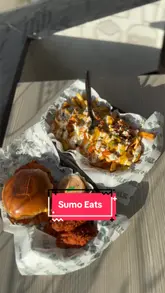 A creator presents a Nashville Munch Box from MLK Burgers in Manchester, promoting a discount available through the Sumo Eats app. The video features the creator talking to the camera while holding the food, followed by a taste test and a demonstration of the app interface.