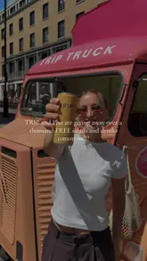 A promotional video for a giveaway event featuring a branded 'Trip Truck' serving free salads and drinks in London.
