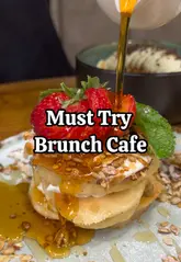 A food review reel showcasing various brunch dishes at Kardoma cafe, including a full English breakfast, pancakes, shakshuka, and pastries.