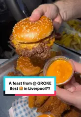 A fast-paced food review video featuring a large spread of burgers, fried chicken, fries, and desserts from a venue called Groke. The creator showcases the food in close-up detail, including dipping sauces and textures, while also providing a brief look at the venue's exterior and menu board.