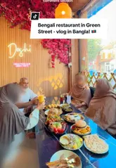 A vlog-style review of Deshi Food Hub on Green Street, showcasing a family meal with a variety of authentic Bangladeshi dishes, including a bhorta platter and fuchka, in a welcoming, family-friendly atmosphere.