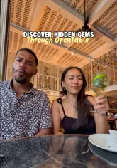A couple visits Chourangi, an Indian restaurant in Marylebone, London, after finding it on OpenTable. The video features shots of the restaurant's interior, the booking process on the app, and a variety of dishes including tandoori lamb chops and tiger prawn malai curry.