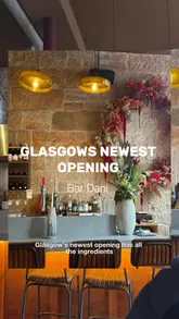 A couple visits the newly opened Bar Dani in Glasgow, showcasing the Basque-inspired wine bar's interior, menu, and a selection of dishes including steak, bifana, and clams.