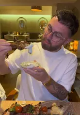 A video review of Onyxè, a Mediterranean restaurant in Salford, featuring a group of friends enjoying a variety of meze, grilled meat platters, and desserts. The video highlights the restaurant's atmosphere, wine selection, and table-side service.