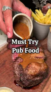 A food review video showcasing various dishes at The Brook & Badger, a historic pub in London. The creator highlights several menu items including starters, mains, and desserts.