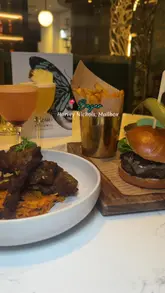 A polished montage showcasing the interior, food, and drinks at Bazar in The Mailbox, Birmingham. The video uses smooth transitions and high-quality lighting to highlight the venue's stylish atmosphere and menu offerings.