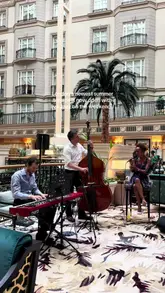 A montage video showcasing the summer terrace at The Landmark London, featuring live jazz music, cocktails, and a selection of food items including sandwiches, salad, and a dessert sundae.
