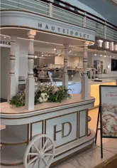 A visual showcase of the brunch menu at Haute Dolci in the Trafford Centre, featuring Turkish eggs, an egg-stuffed croissant, mocktails, and their signature Matilda cake.