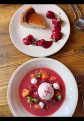 A vibrant food review showcasing the new summer menu at The Ropemakers in Emsworth. The video features close-up shots of various dishes including a scotch egg, dressed crab, a beef burger, and a strawberry-themed dessert, interspersed with glimpses of the pub's interior and exterior. The creator provides a voiceover commentary, highlighting the seasonal offerings and the value of the weekday lunch menu.