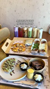 A short, montage-style video showcasing the food, drinks, and atmosphere of Tea Point in Ilford, highlighting their Dubai-inspired menu and late-night opening hours.