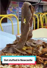 A straightforward video tour of a takeaway venue called 'Get Stuffed' in Newcastle, featuring shots of the exterior, interior, menu, and food items like pizza and doner kebab.