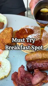 A short, energetic review of The Breakfast Club in St Albans, featuring a variety of breakfast dishes including pancakes, a full English breakfast, eggs Benedict, and French toast, accompanied by a matcha latte.
