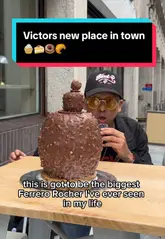 A creator visits Victor's Patisserie & Gelato in Liverpool, showcasing their unique, hyper-realistic fruit-shaped cheesecakes, giant pastries like a massive Ferrero Rocher and croissant, and homemade gelato. The video features the owner, Victor, and includes a taste test of several desserts.