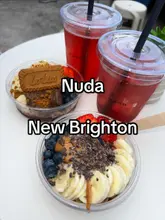 A vlog-style review of a new cafe called Nuda in New Brighton, showcasing their acai bowls, iced coffees, and aesthetic interior.