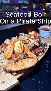 A review of Roots Restaurant & Bar in Manchester, showcasing their seafood boil, seafood pasta, oxtail, and mixed grill. The creator highlights the generous portions, smoky BBQ flavours, and the restaurant's atmosphere.