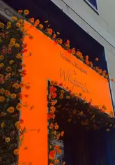 A montage of the interior and exterior of Whitcomb's at The Londoner, featuring champagne service, various dishes, and the restaurant's elegant dining space.