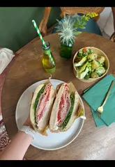 A vibrant vlog-style review of Galley Delicatessen in Leeds' Kirkgate Market, highlighting the fresh, made-to-order sandwiches and salads, the quality of ingredients, and the friendly atmosphere.